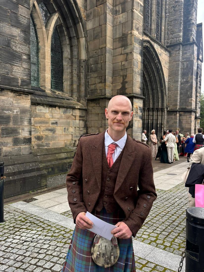 Kilt inspiration — a guest in full kilt outfit outside a cathedral